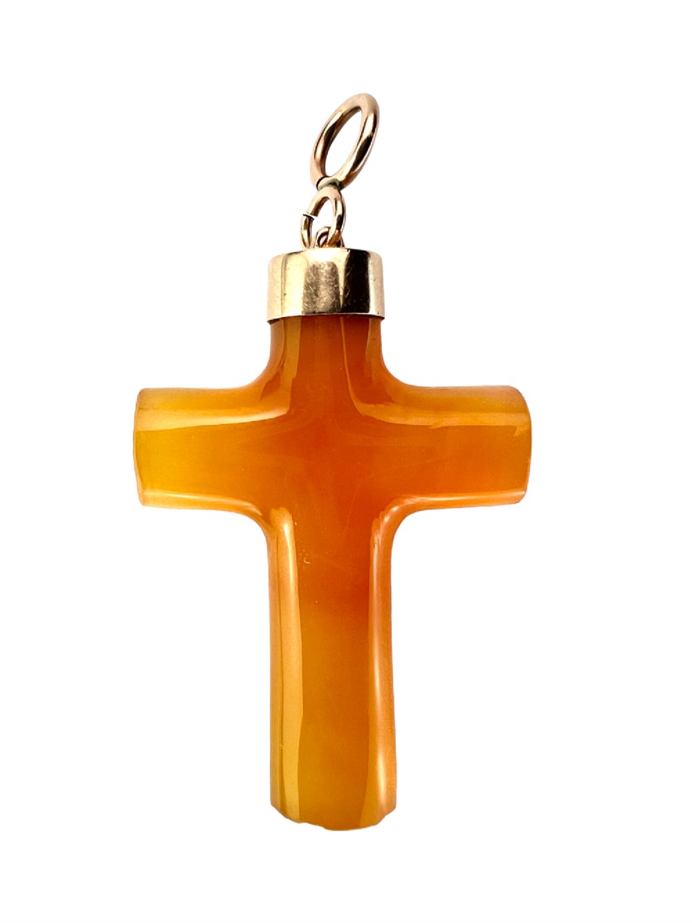 A carved translucent amber agate cross pendant featuring a polished gold cap and suspension bail. View II