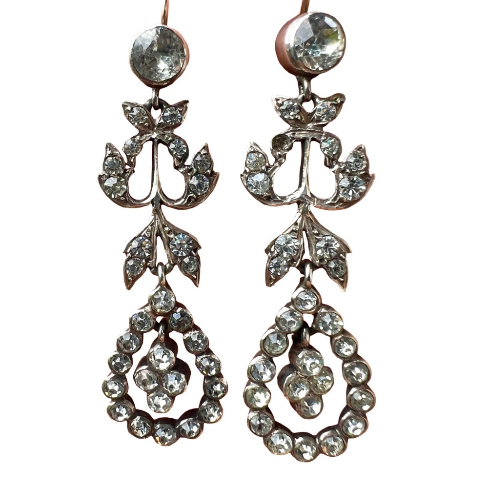 Pair of nineteenth-century silver drop earrings set with clear faceted paste glass stones in an articulated chandelier motif.