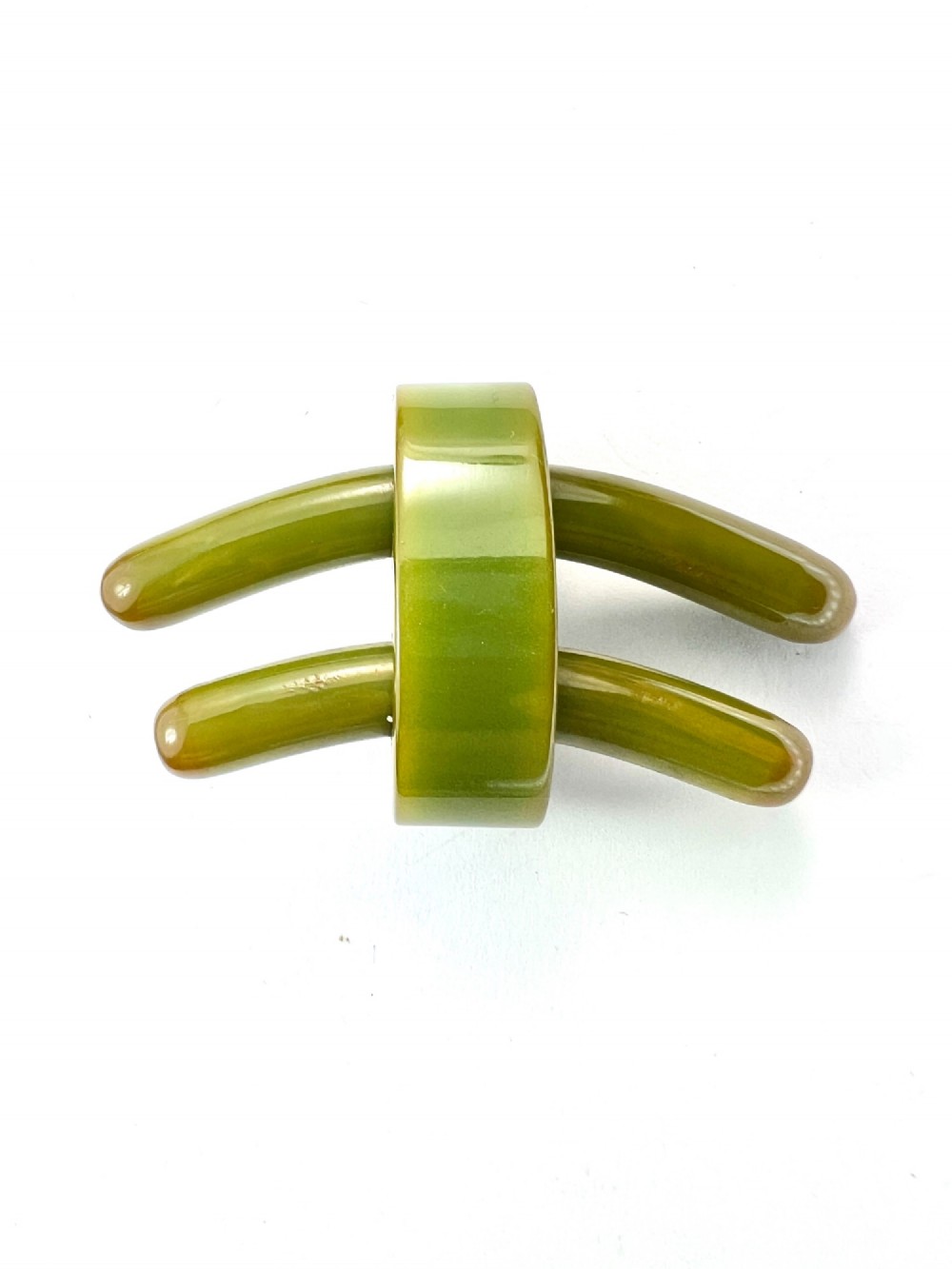 An Art Deco olive green Bakelite brooch featuring curved geometric bars joined by a central band. View II