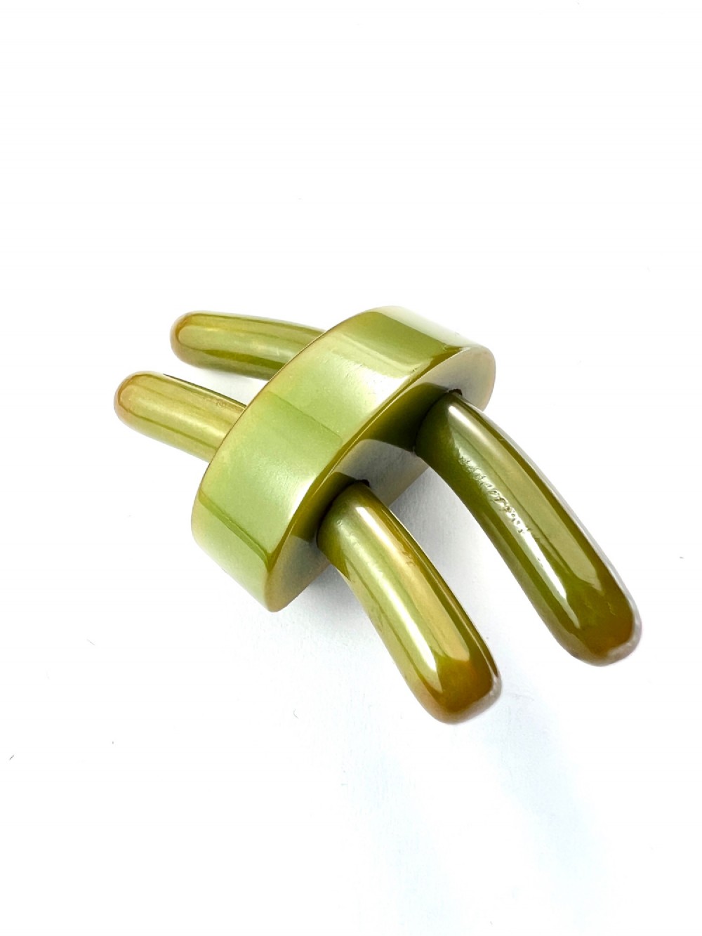 An Art Deco olive green Bakelite brooch featuring curved geometric bars joined by a central band. View III