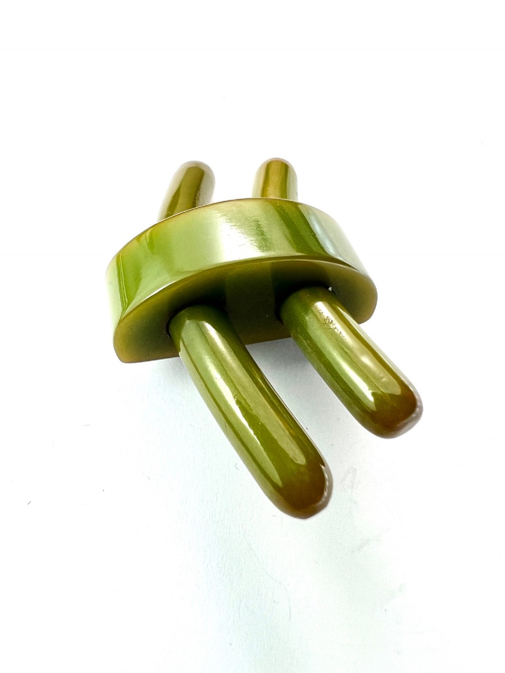 An Art Deco olive green Bakelite brooch featuring curved geometric bars joined by a central band. View V