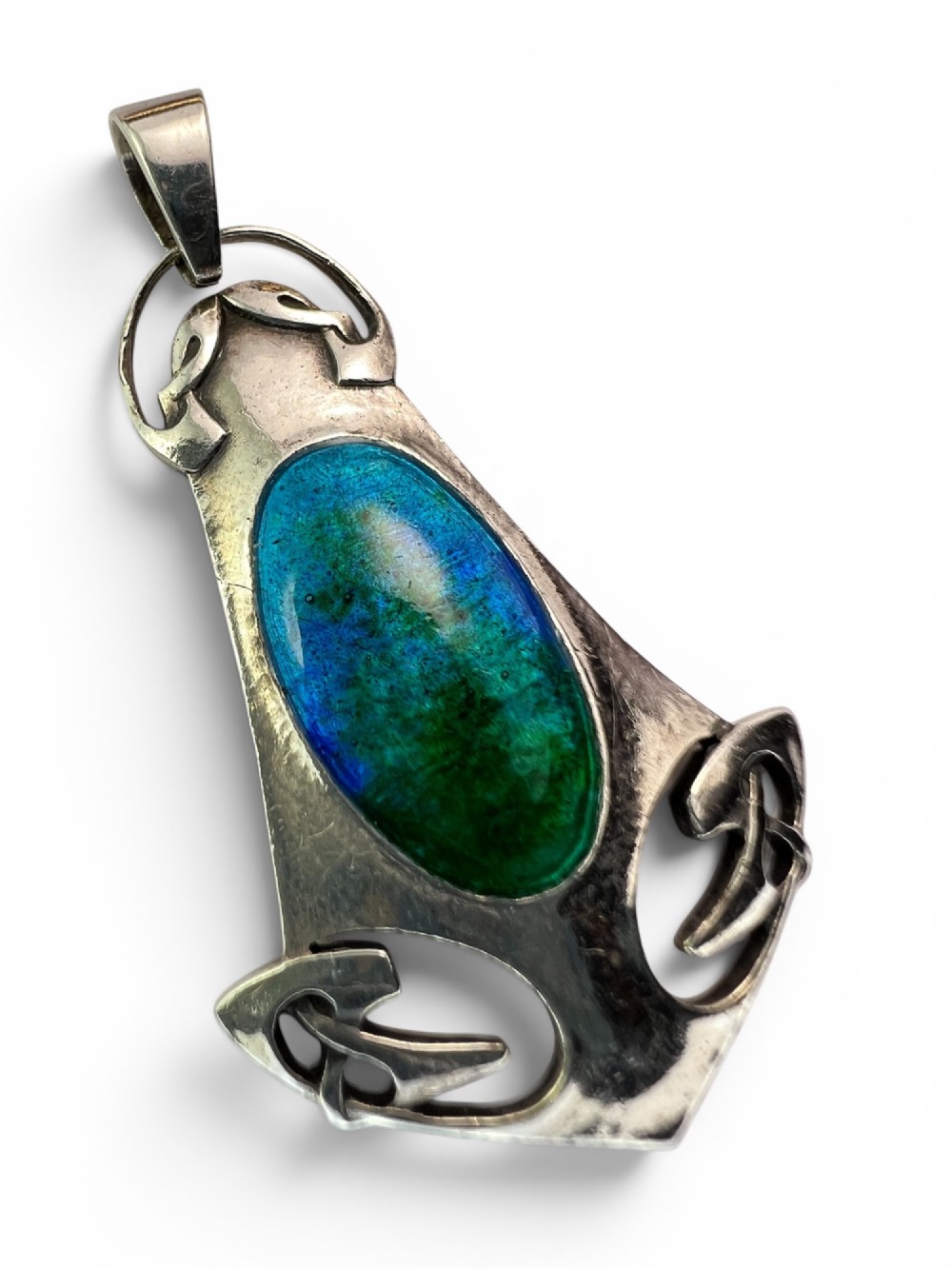 A silver Arts and Crafts style openwork pendant featuring stylised Celtic knots around a central oval blue and green enamel insert. View II