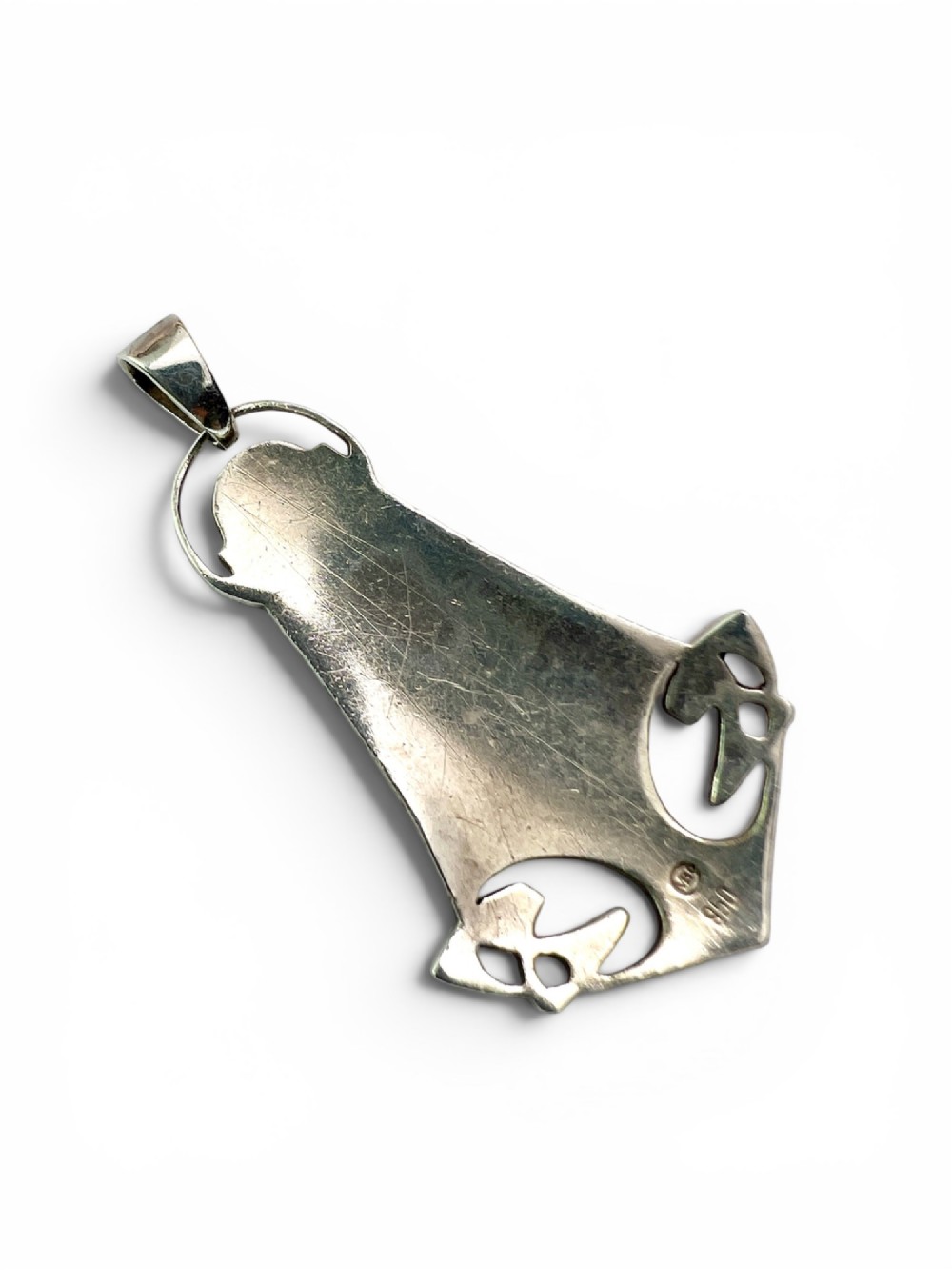 A silver Arts and Crafts style openwork pendant featuring stylised Celtic knots around a central oval blue and green enamel insert. View III