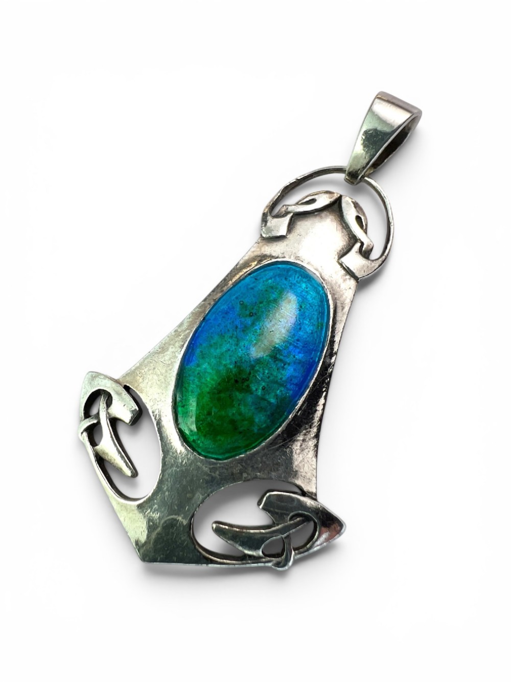 A silver Arts and Crafts style openwork pendant featuring stylised Celtic knots around a central oval blue and green enamel insert. View IV