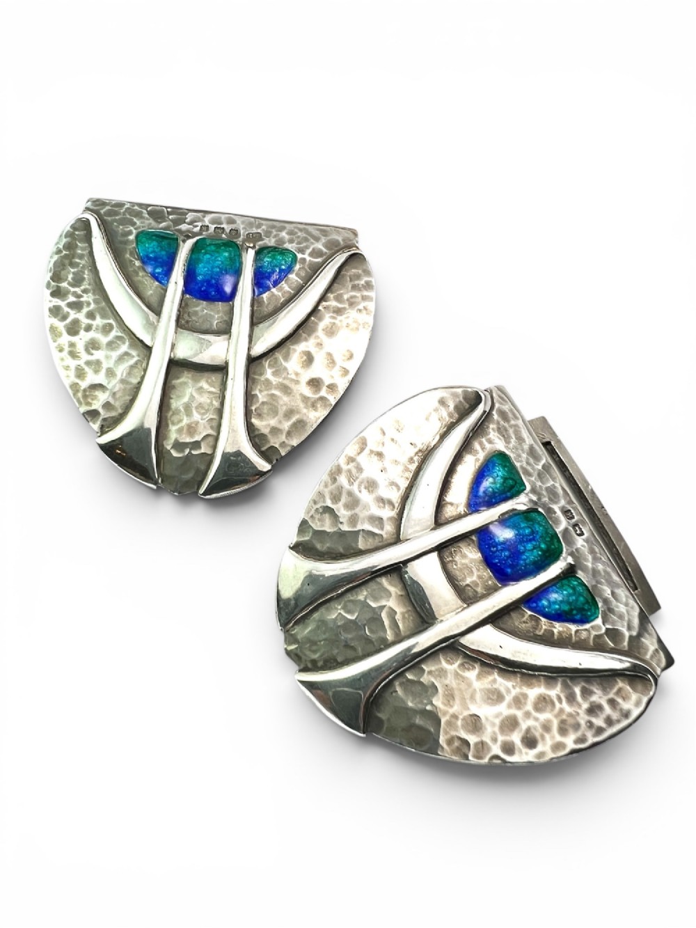 A two-part Art Nouveau sterling silver belt buckle featuring hand-hammered oval surfaces inlaid with vibrant blue and green enamelling and hallmarked in the centre. View II