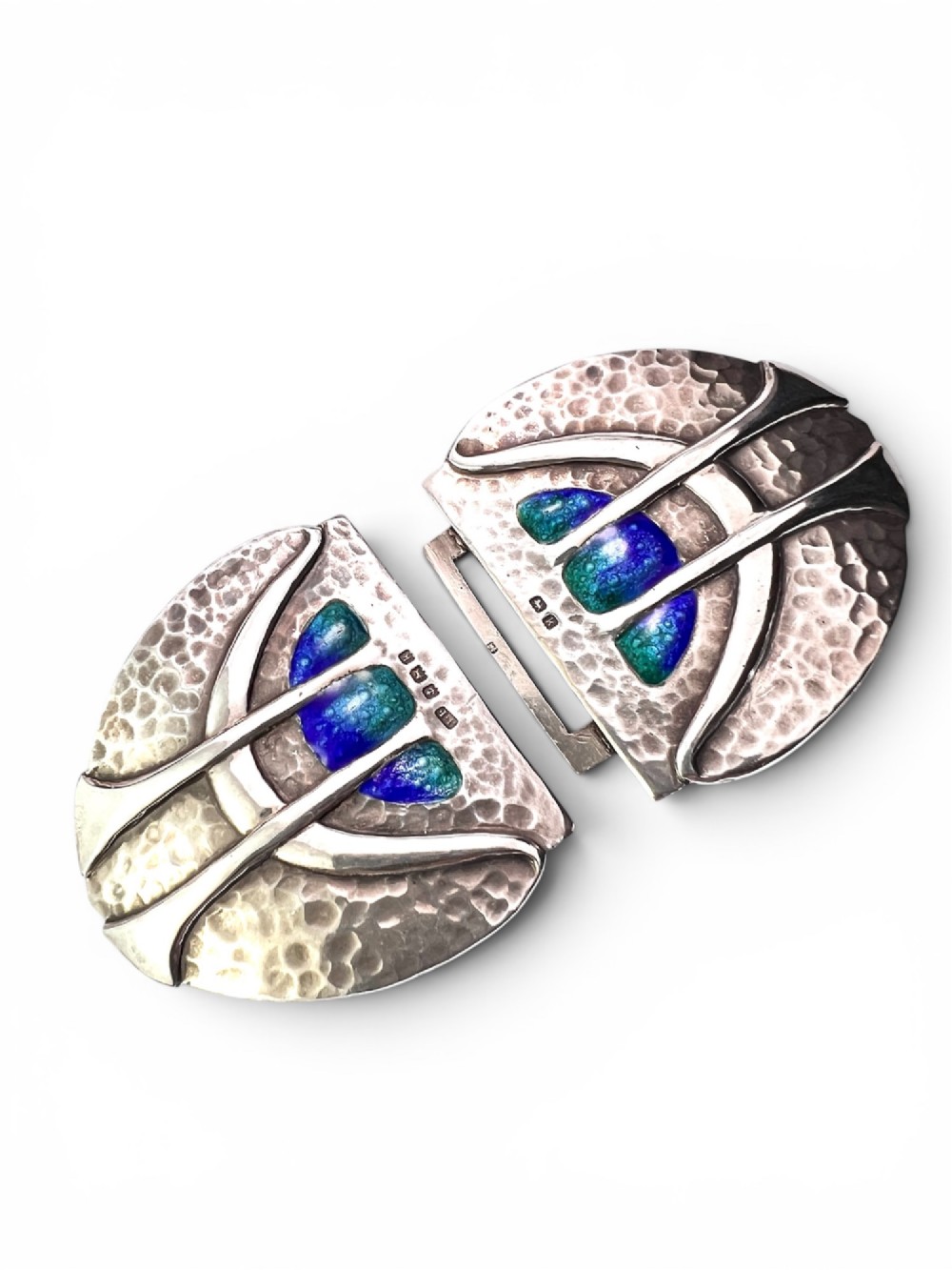 A two-part Art Nouveau sterling silver belt buckle featuring hand-hammered oval surfaces inlaid with vibrant blue and green enamelling and hallmarked in the centre. View III
