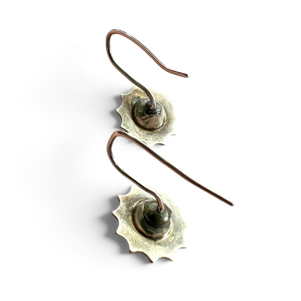 A pair of Victorian gold drop earrings featuring starburst-engraved settings with central clear round paste stones and shepherd hook fastenings. View IV