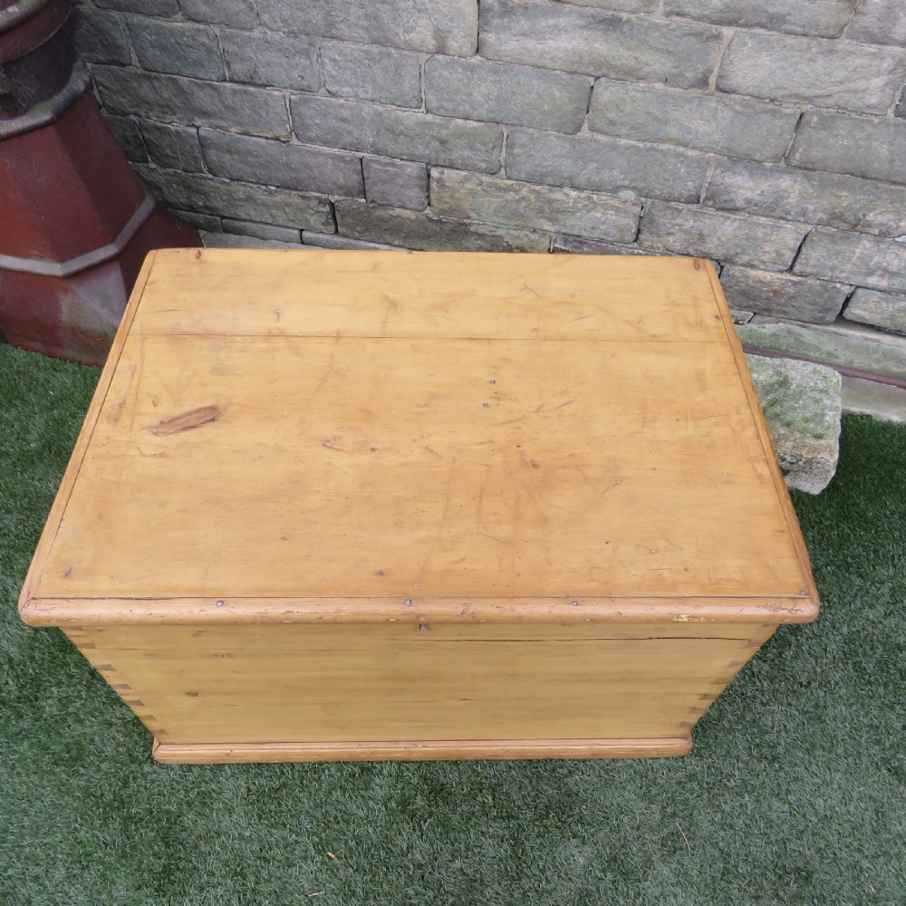 A rectangular Victorian pine blanket chest featuring visible dovetail joint corner construction, a hinged top lid, and a moulded base. View IV