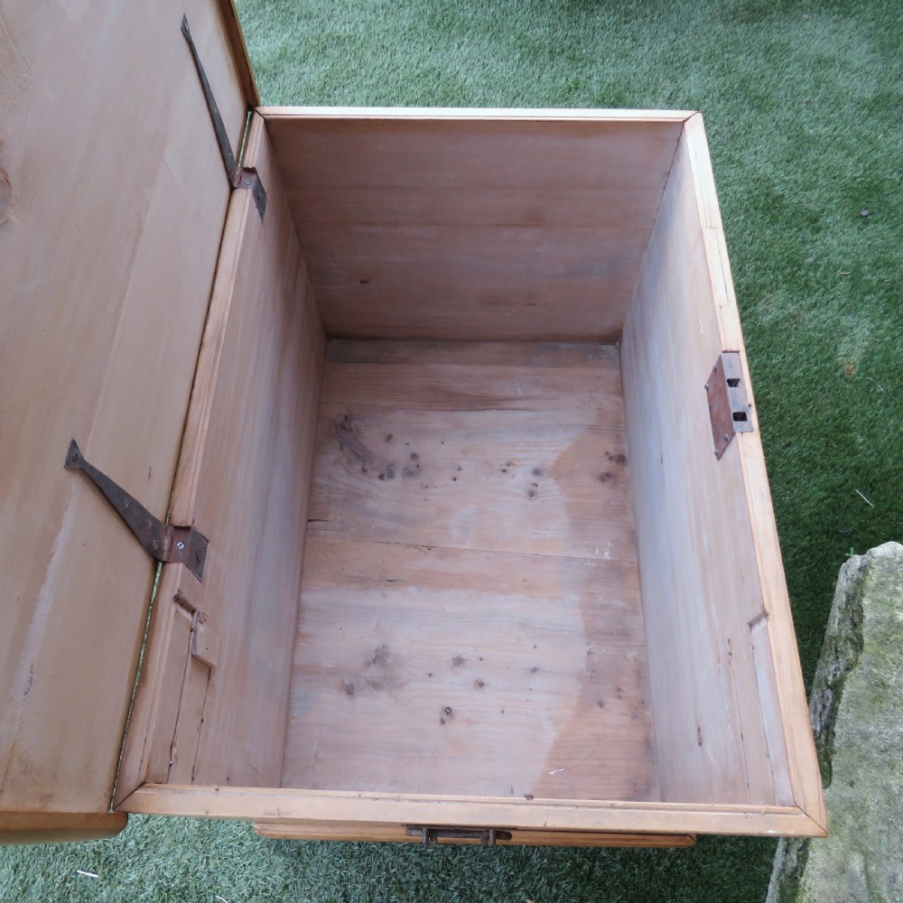 A rectangular Victorian pine blanket chest featuring visible dovetail joint corner construction, a hinged top lid, and a moulded base. View X