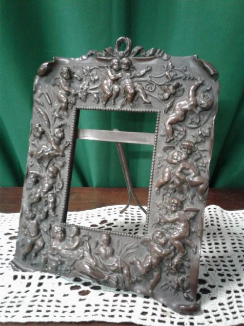 A Fine Victorian Bronze Cherub Picture Frame.