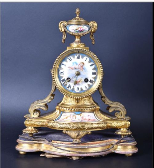 A 19th Century French Drumhead Ormolu and Painted Porcelain Mantle Clock