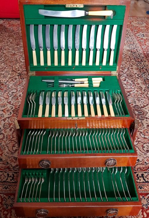 A Good Mahogany Cased Canteen of Cutlery. Bone Handles