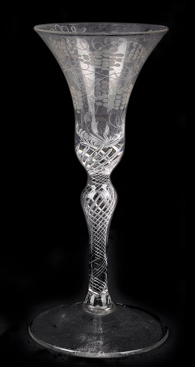 fig 1. An engraved airtwist stem wine glass mid 18th century the bell bowl