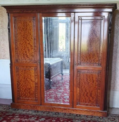 A Superb Edwardian Plum Pudding Mahogany Triple Wardrobe.