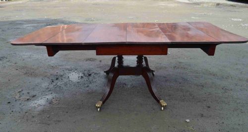 A Late Georgian Drop Leaf Extending Mahogany Dining Table