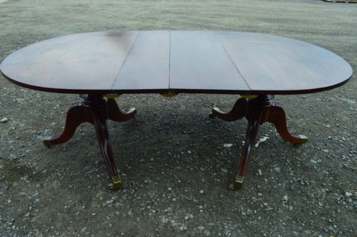 A GEORGE III MAHOGANY DOUBLE D END PEDESTAL DINING TABLE