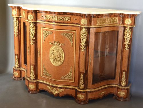 A Fine French Burr Walnut Serpentine Credenza.