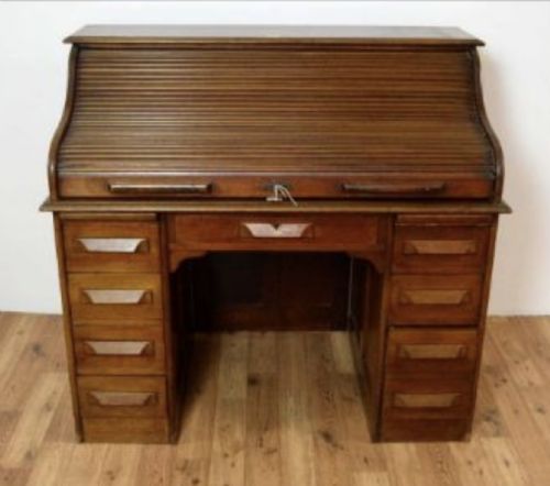 A Mahogany Roll Top Desk.