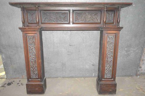 A Victorian Carved Oak Fire Surround.