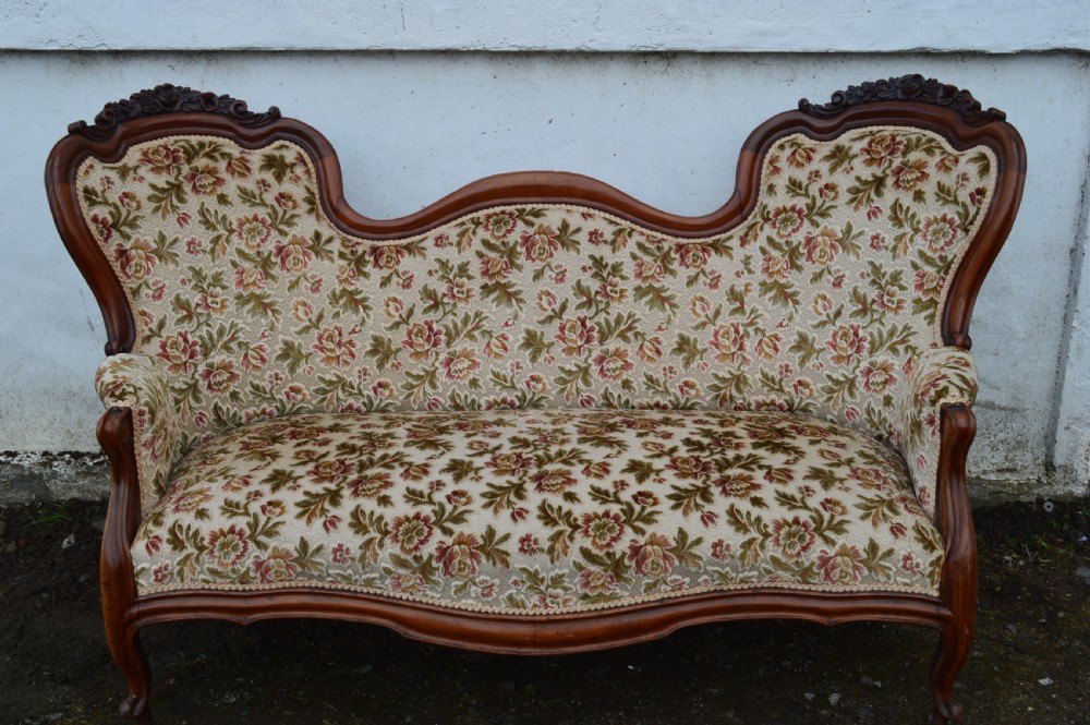 A Victorian mahogany double-ended sofa
