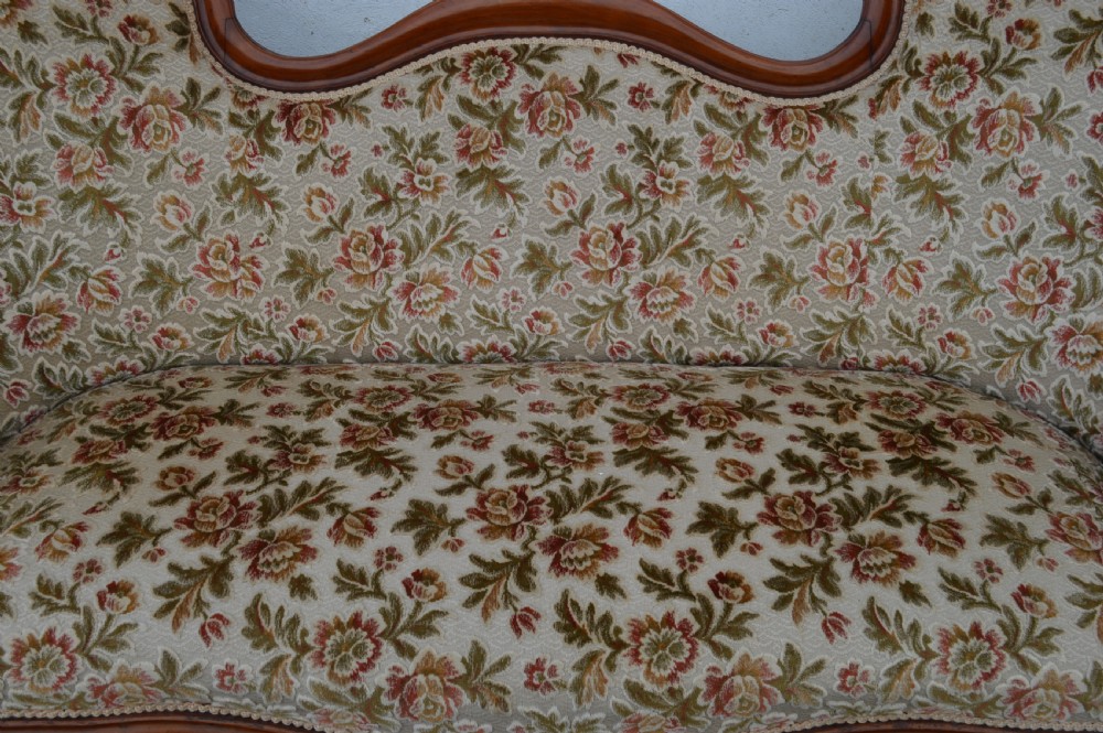 A Victorian mahogany double-ended sofa View II