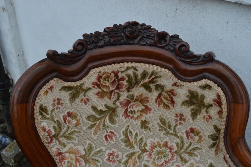 A Victorian mahogany double-ended sofa View III