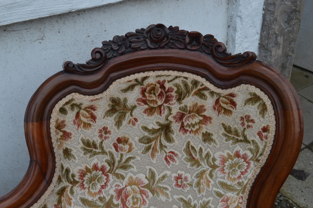 A Victorian mahogany double-ended sofa View IV