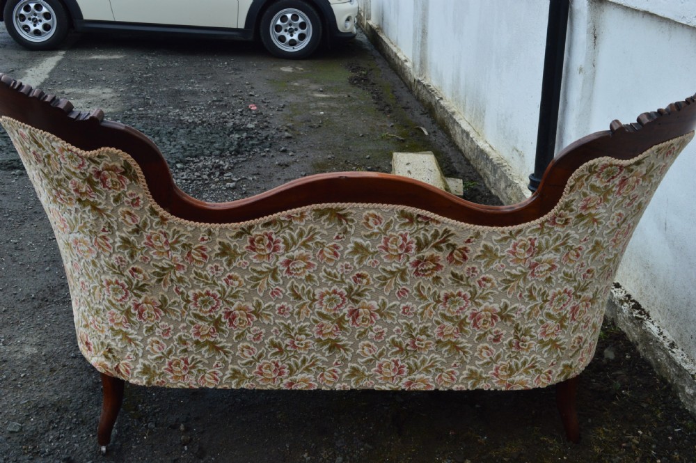 A Victorian mahogany double-ended sofa View VII