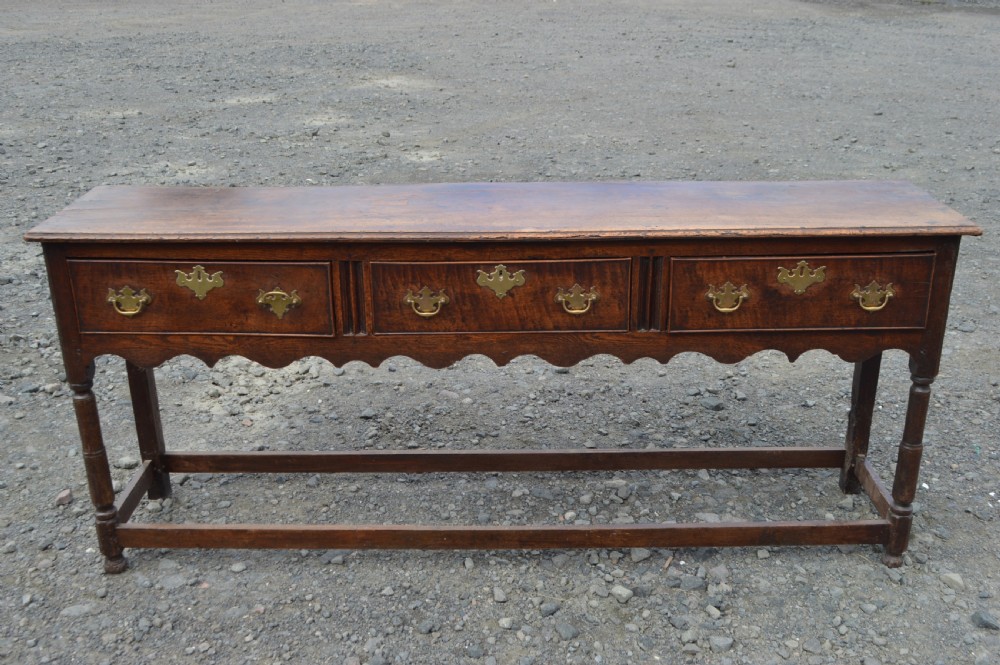 An 18th century oak bench dresser 
