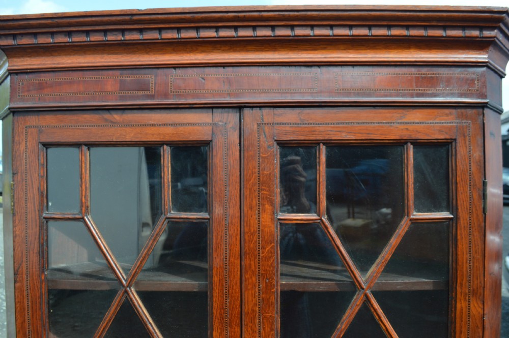 A Georgian oak corner cabinet on base View II