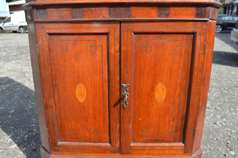 A Georgian oak corner cabinet on base View III