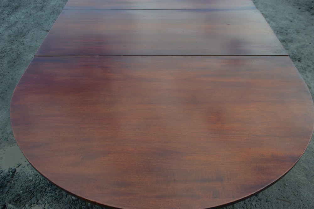 large 18th century three pedestal mahogany dining table with 2 leaves. View V