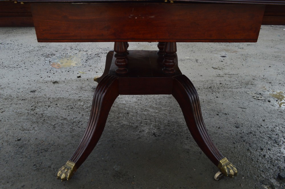A Late Georgian Drop leaf extending mahogany dining table View III