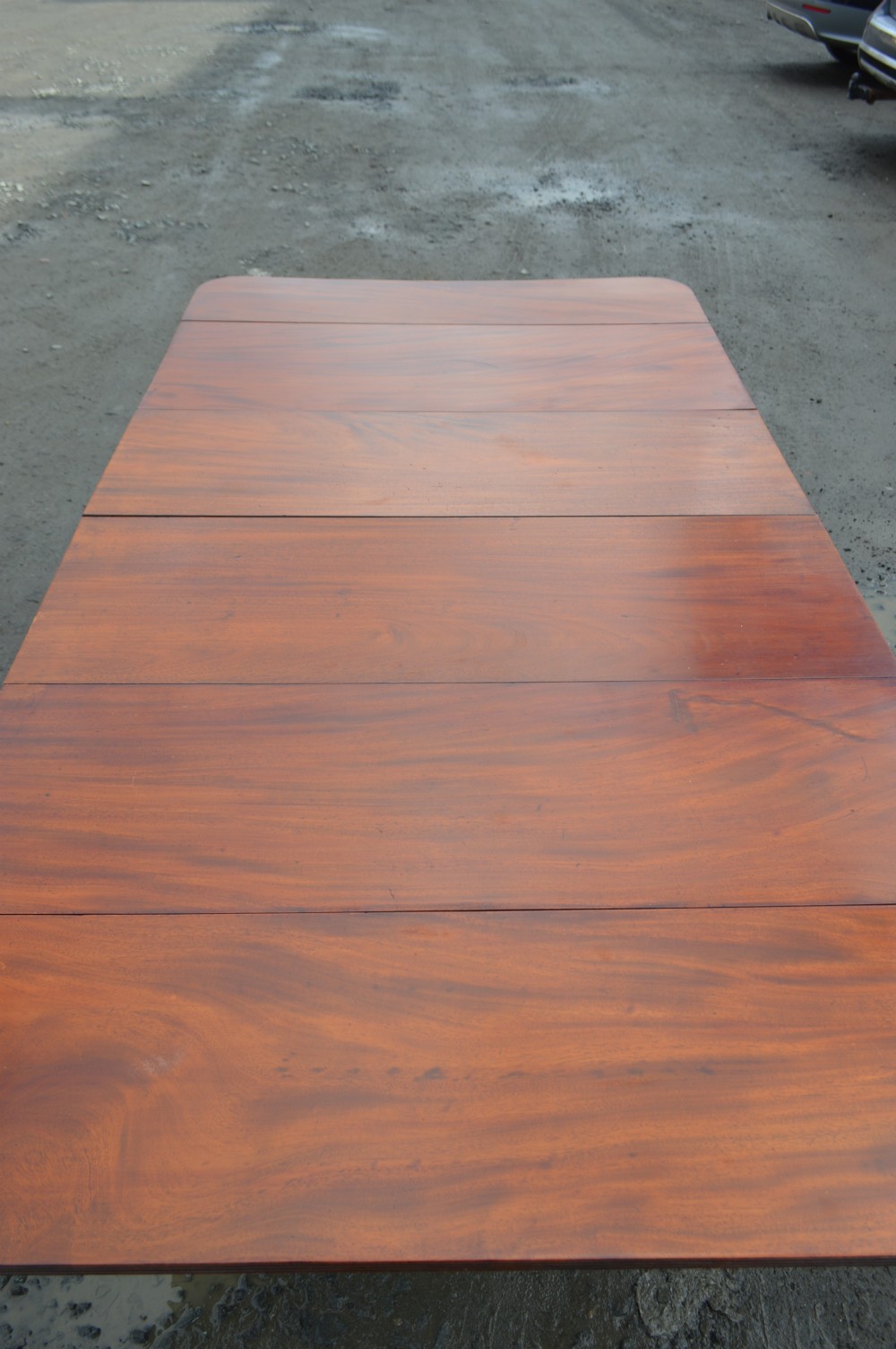 A Late Georgian Drop leaf extending mahogany dining table View IV