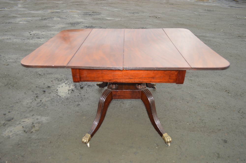 A Late Georgian Drop leaf extending mahogany dining table View V