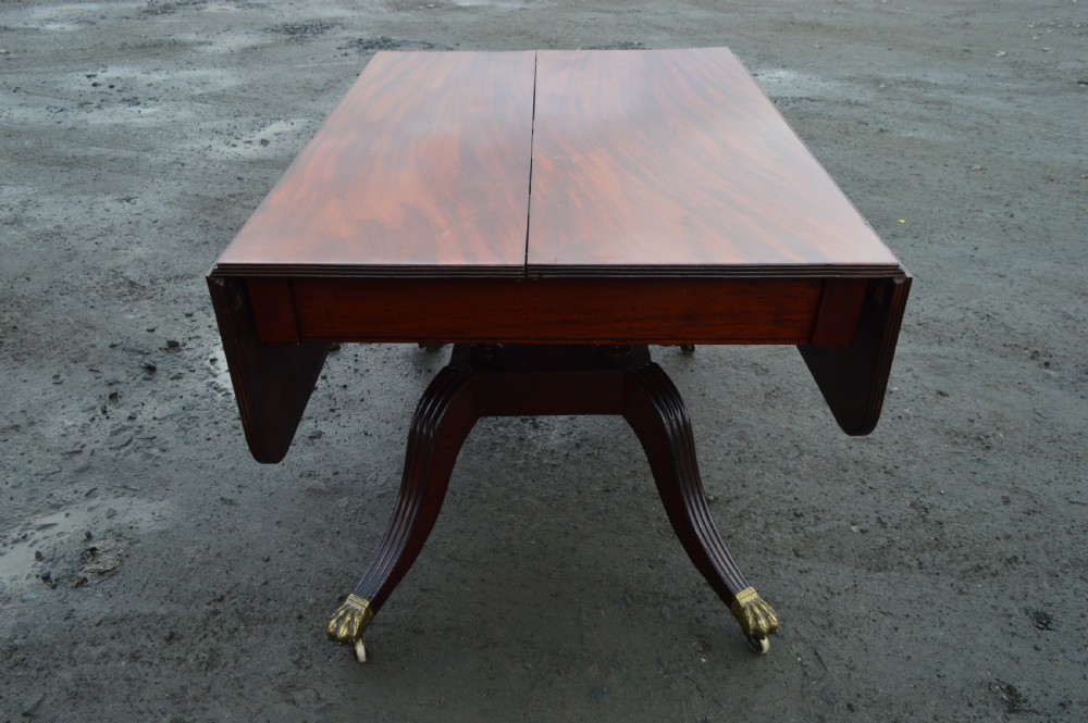 A Late Georgian Drop leaf extending mahogany dining table View VI