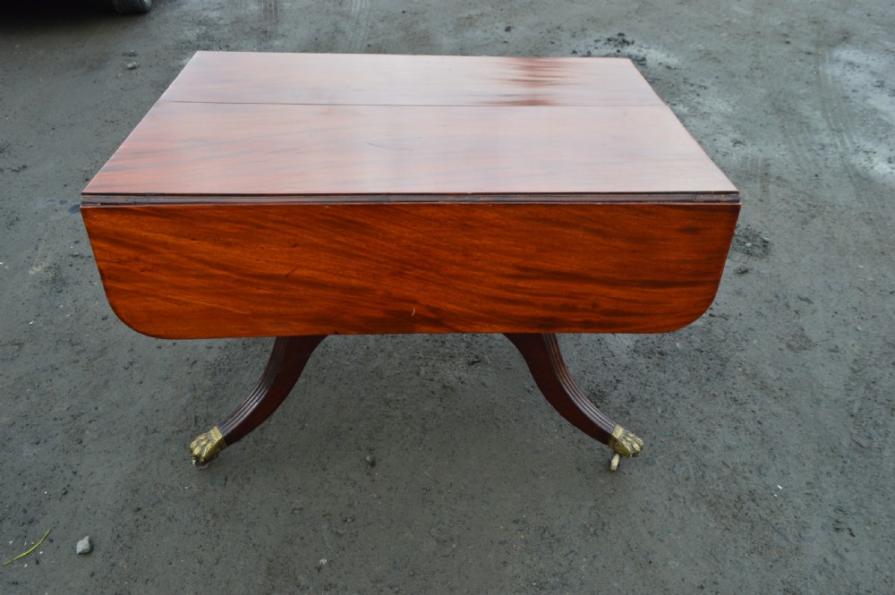 A Late Georgian Drop leaf extending mahogany dining table View VII