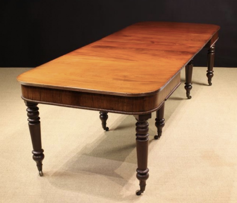 A fine Gillows type mahogany extending dining table.