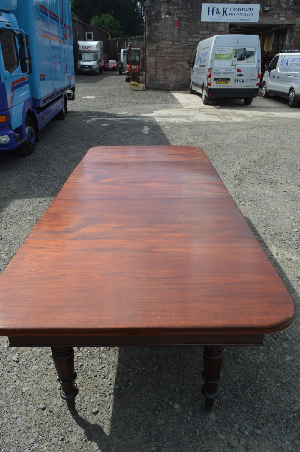 A good early Victorian extending mahogany dining table View II
