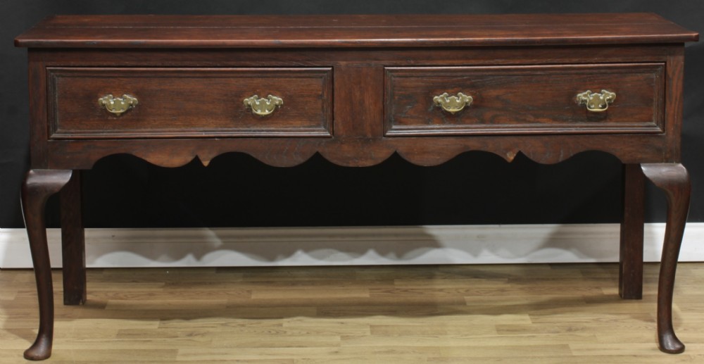 A Victorian 18th century revival oak low dresser