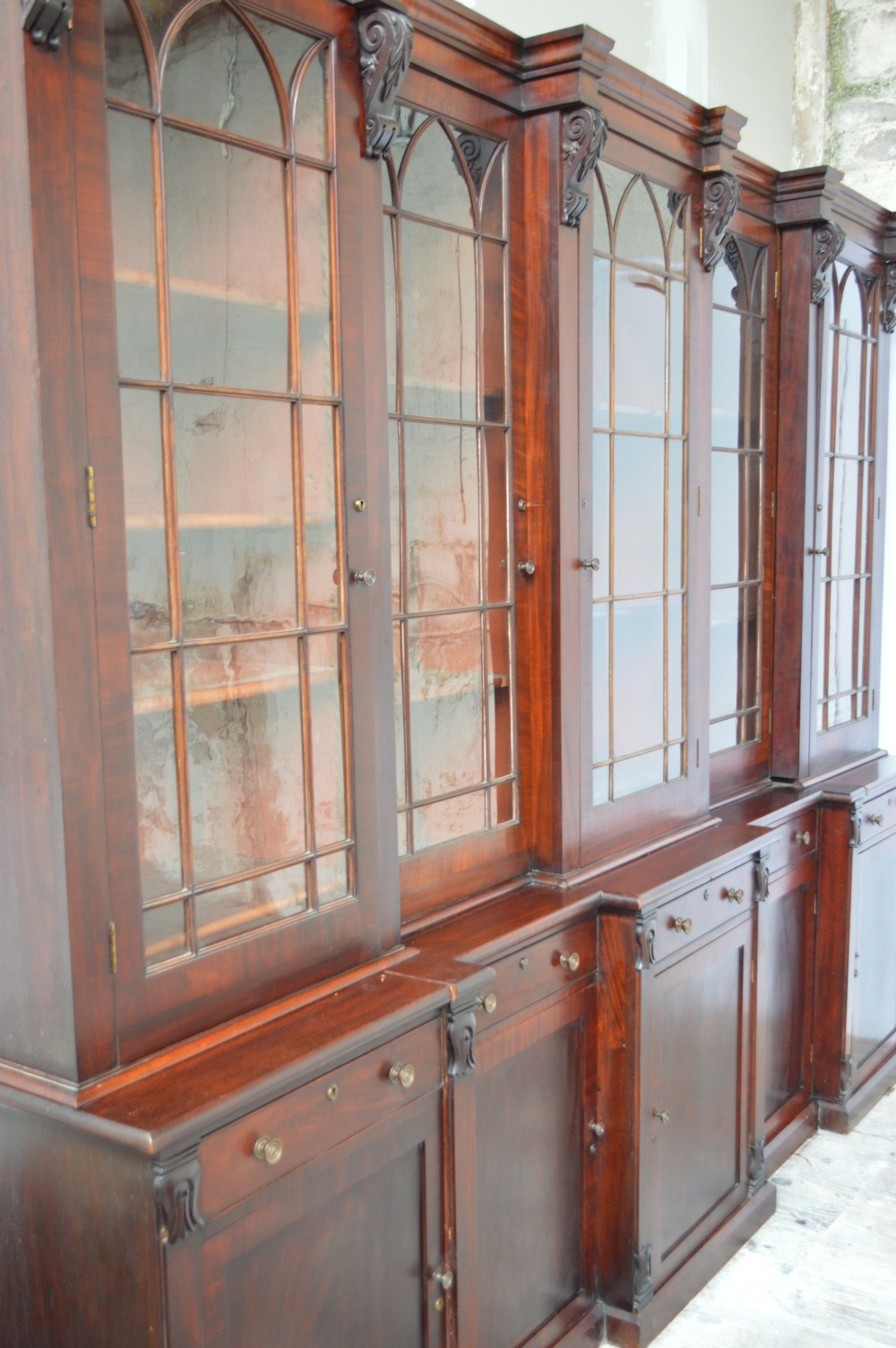 Regency period mahogany five door breakfront bookcase View II