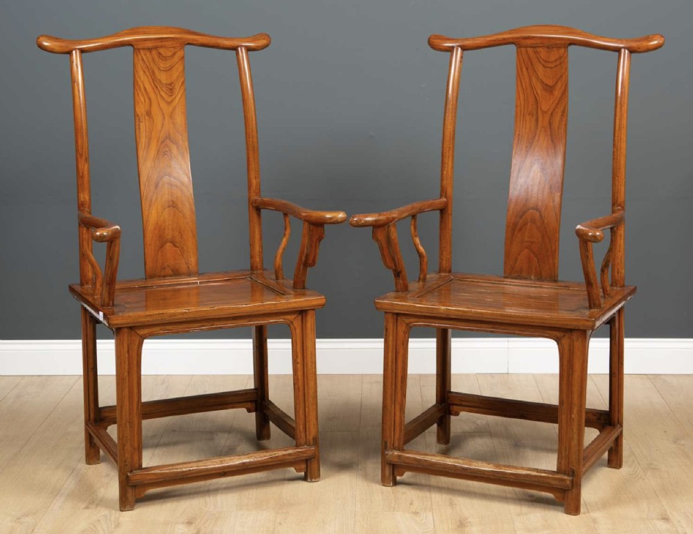 A pair of Chinese elm open armchairs