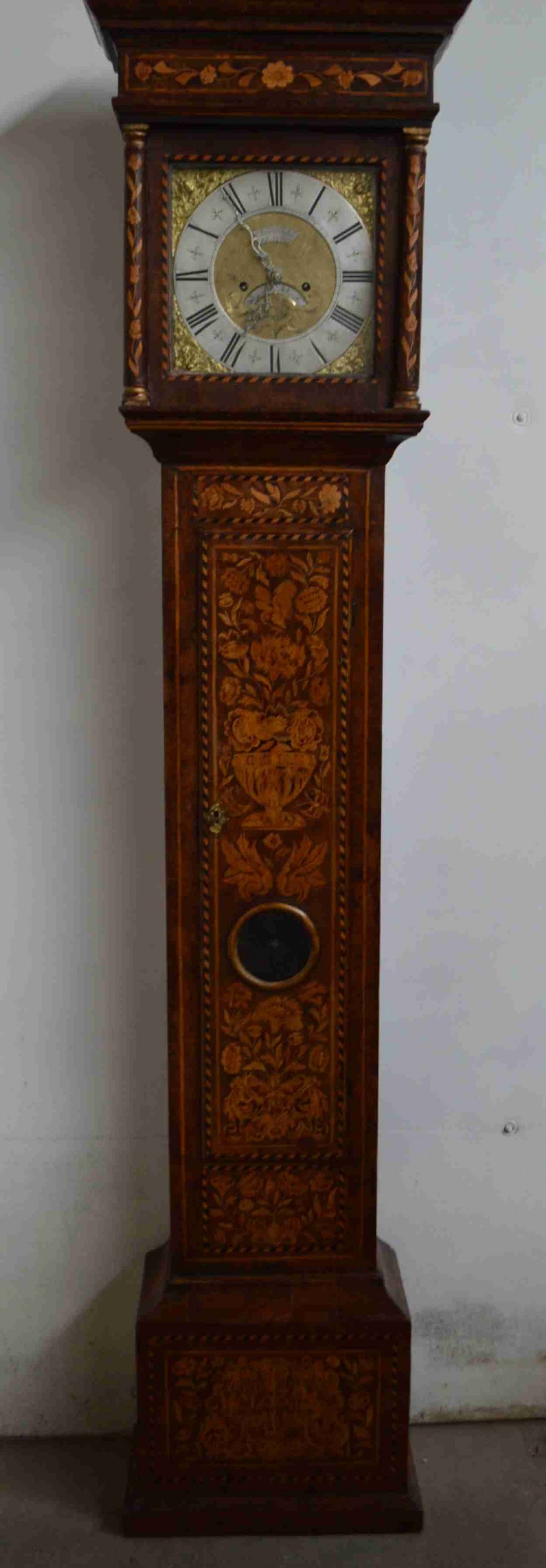 A good  marquetry long case clock. Circa 1725