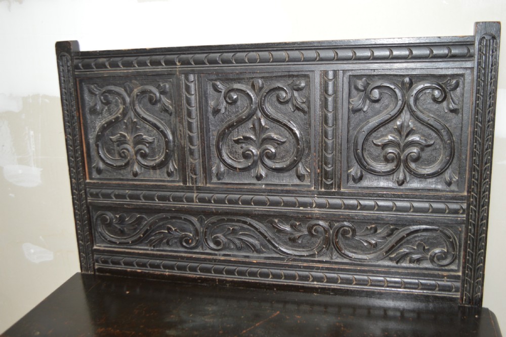 A 19th century carved oak hall bench View II