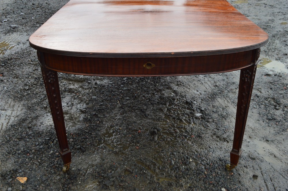 A Edwardian Robert Adam revival extending dining table View IV