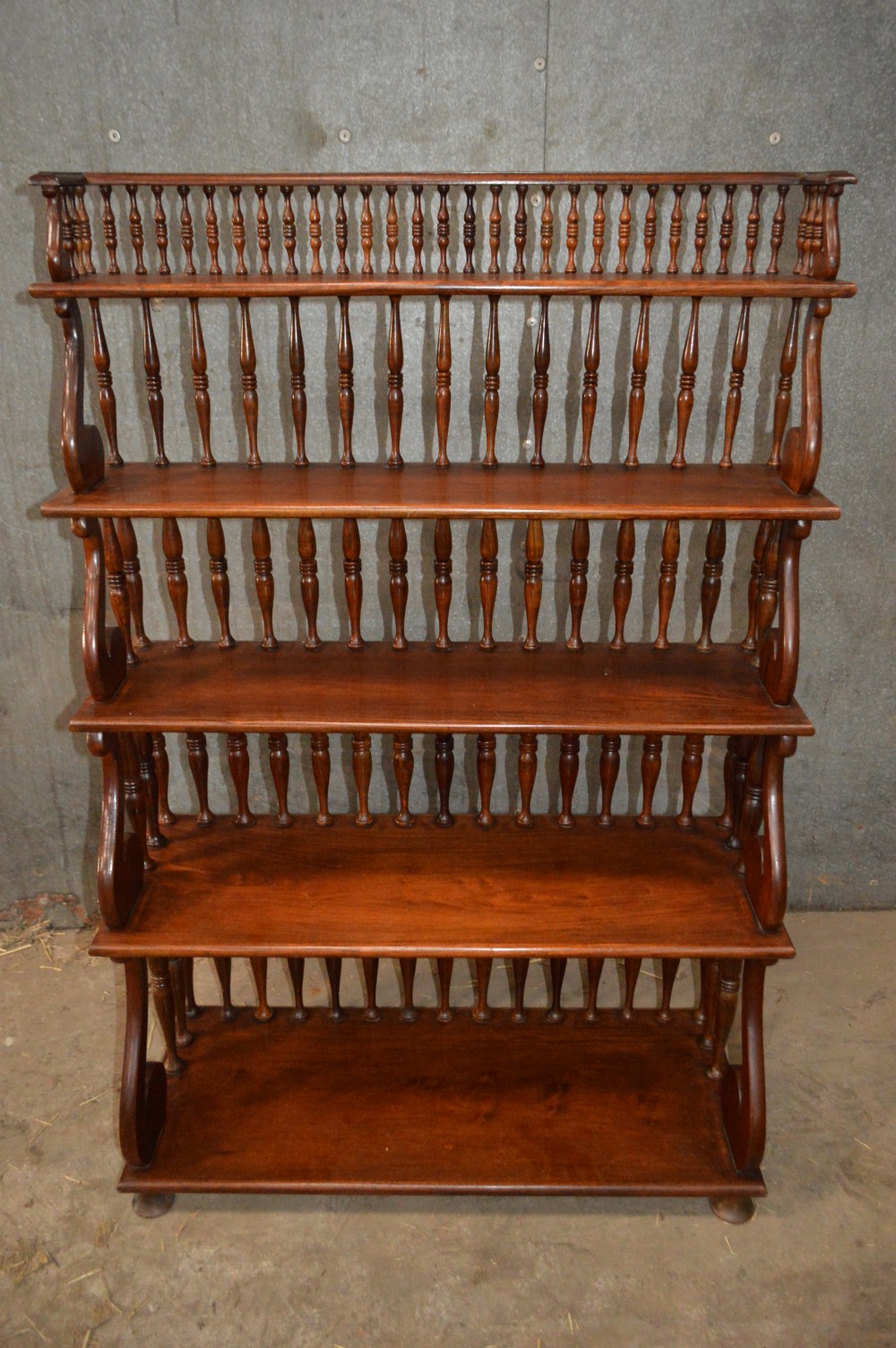 A Victorian mahogany waterfall open bookcase.
