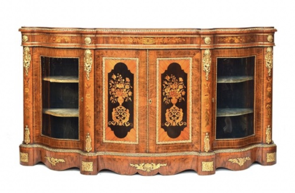 A Victorian breakfront burr walnut credenza with floral marquetry center panels, curved side glass doors, and gilt mounts.