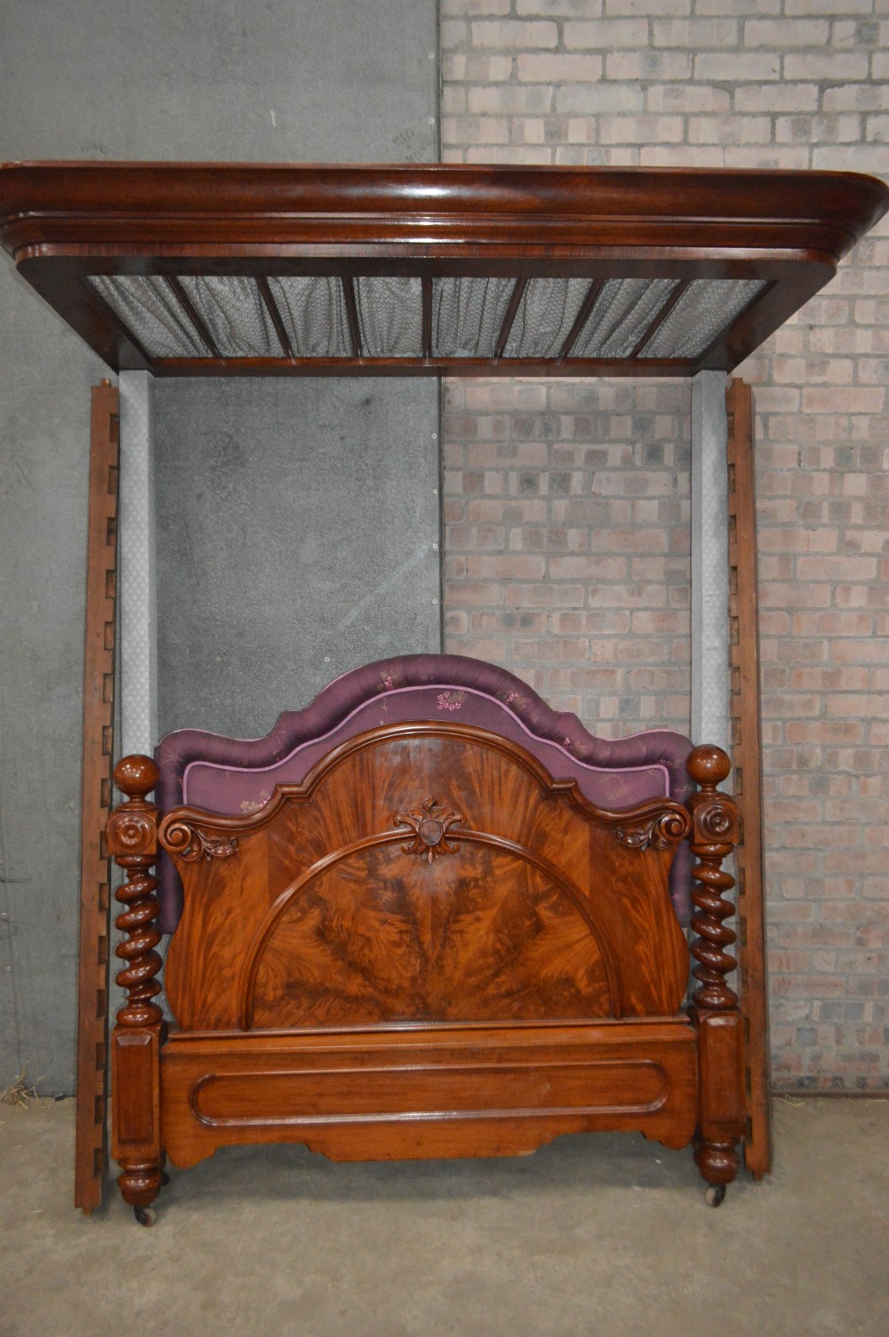A Victorian mahogany half tester bed