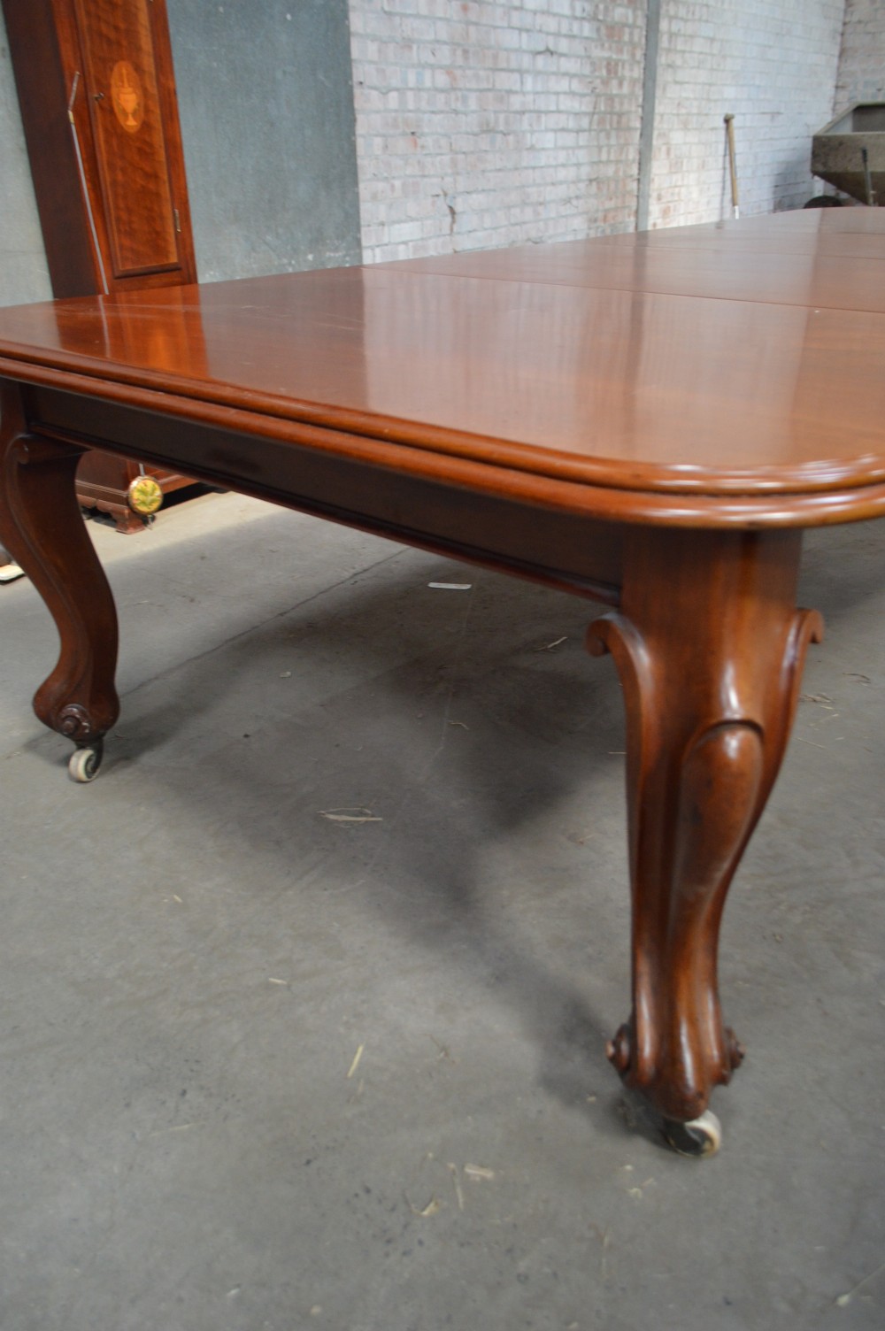 A Victorian Large mahogany extending dining table. View II