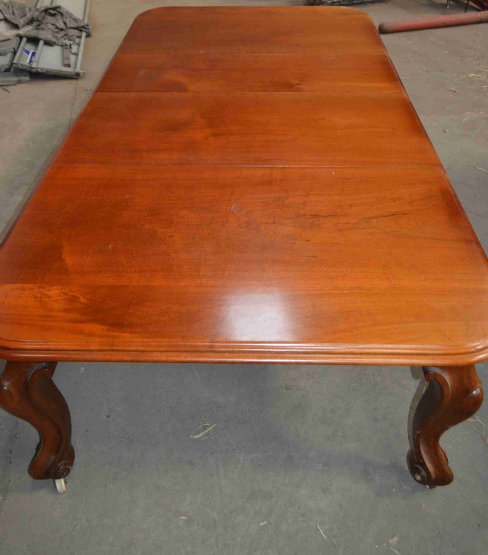 A Victorian Large mahogany extending dining table.